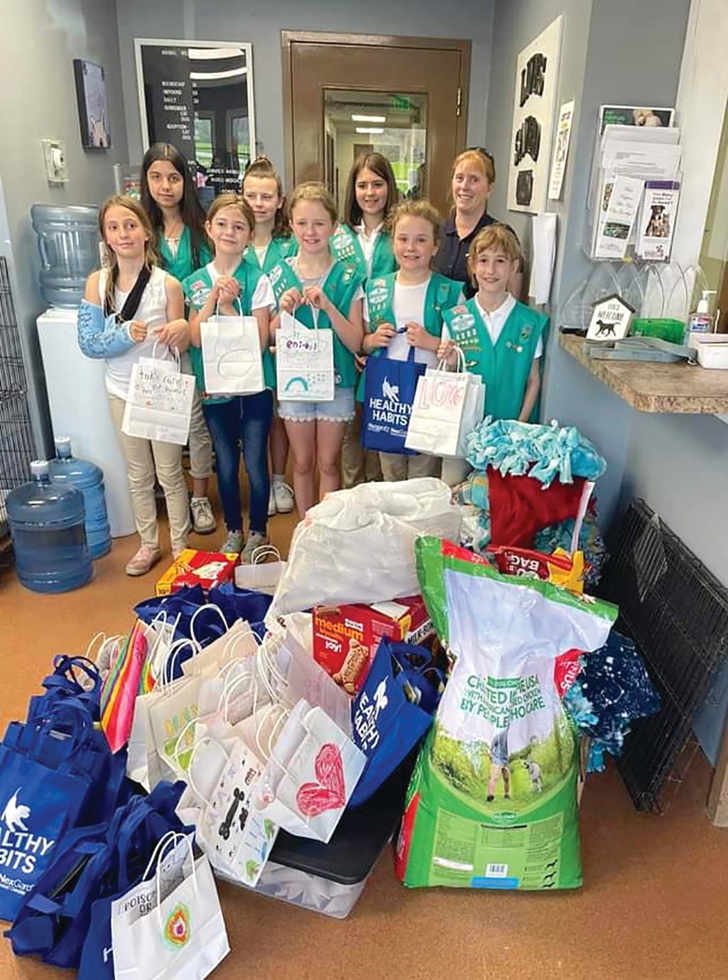 Local Girl Scout Troop 4383 of Montgomery County delivers tie blankets, toys and more Saturday to the Animal Welfare League. The project earned the troop to coveted Bronze Award, sought by more than half a million Scouts each year. Members visiting AWL Saturday were Jillian Clark, back, from left, Keliegh Anderson, Bella Hutson, leader Chelsea Wilkins, Journey Hinchman, front, from left, Anna Bowers, Abriella Purple, Elliot Hamilton and Brooklyn Wilkins.